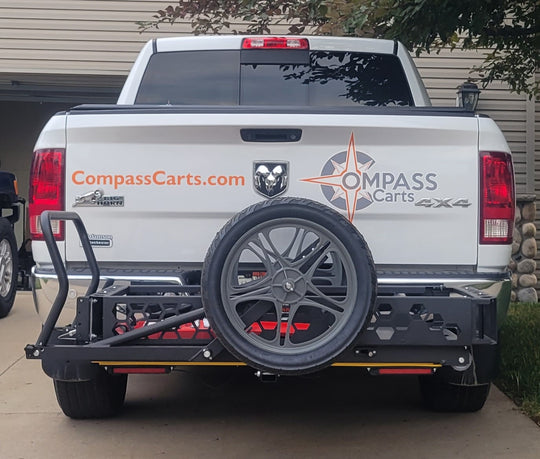 The Compass Cart System loaded onto the back of a white pickup truck